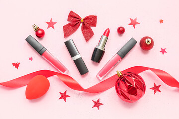 Obraz na płótnie Canvas Lipsticks with Christmas decor on pink background
