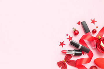 Obraz na płótnie Canvas Lipsticks with Christmas decor on pink background