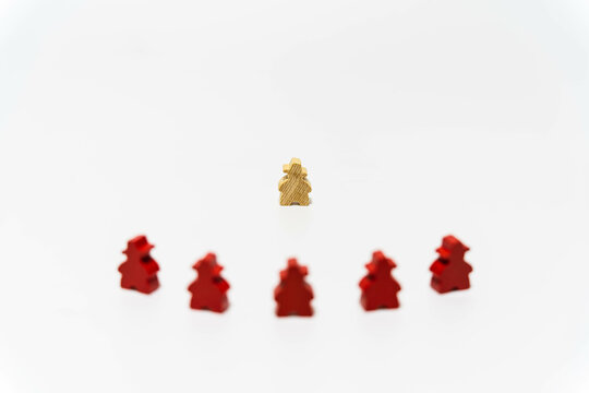 Brave Wooden Pawn Faces Group Of  Red Pawns. It Represents Brave, Confrontation, Business, Small Company Versus Big Company, Competition Concept