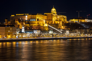 Fototapeta na wymiar Illuminated Buda Castle and Danube river at night. Budapest, Hungary.