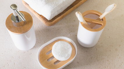 Modern bathroom concept, eco bamboo toothbrushes, white minimalist set, health and skin care background.
