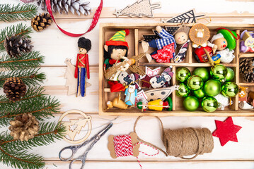 Christmas composition. Christmas decorations, Christmas cones and branches. Preparation for the holiday. Christmas, winter, new year concept. Flat lay, top view, copy space, from above.
