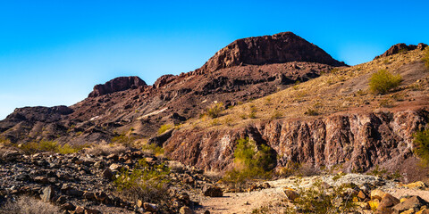 Sara Mountain Park trails arid desert landscape with red rock sandstone formation in Lake Havasu City, Arizona