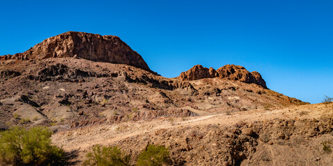 Sara Mountain Park trails arid desert landscape with red rock sandstone formation in Lake Havasu City, Arizona