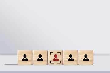 Wooden cubes with human icon on the desk