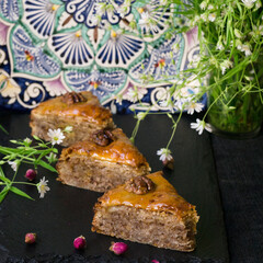 Delicious traditional turkish food baklava with honey and nuts. Oriental sweets with walnuts. Turkish Ramadan dessert. Pahlava. Closeup.