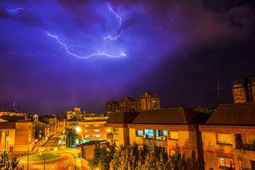 Storm in the city with lightning