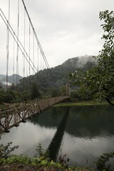 Beautiful view on rusty metal bridge over river in mountains