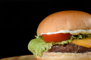 sandwich with beef burger salad onion cheese and bacon fast food
