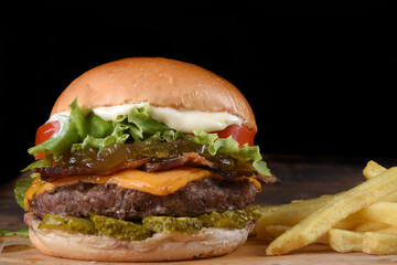 sandwich with beef burger salad onion cheese and bacon fast food