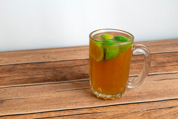 homemade hot tea with slice fresh lime on top. herbal drink for refreshing