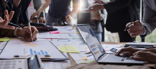 Group of diverse people having a business meeting with documents on his desk, doing planning...