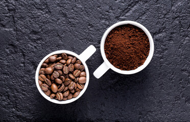 Roasted coffee beans and ground coffee, on dark background, closeup image, space for text