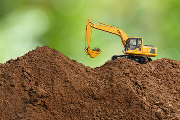 Crawler excavator with bucket lift up are digging  plant a tree  on the environment eco background...