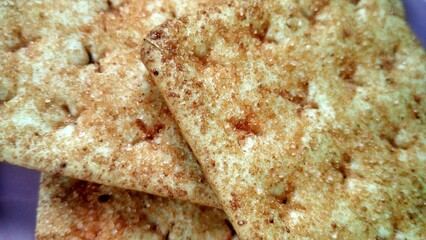 Biscuit crackers topping sprinkled with shredded sugar and so it tastes savory and sweet