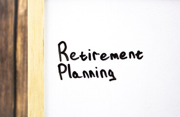 Retirement planning text in black marker on a white board.