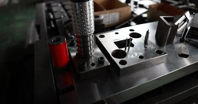 Sheet Metal Stamping Tool Die for Automotive Precision Parts on The Numerical Control Milling Machine Table. Tandem Stamping System. At a High Quality Technology Factory. Slow motion 4K video.