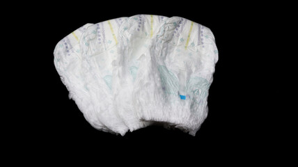 Baby diapers stacked each other on isolated background.