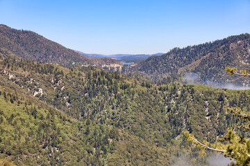 View of San Bernardino Mountains and Big Bear Lake on the horizon from the side of highway 18. Southern California, USA.