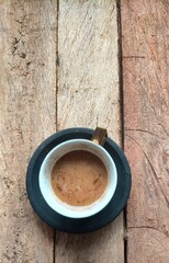 cup of coffee on wood background 