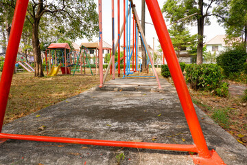 Broken swing in the park, Thailand