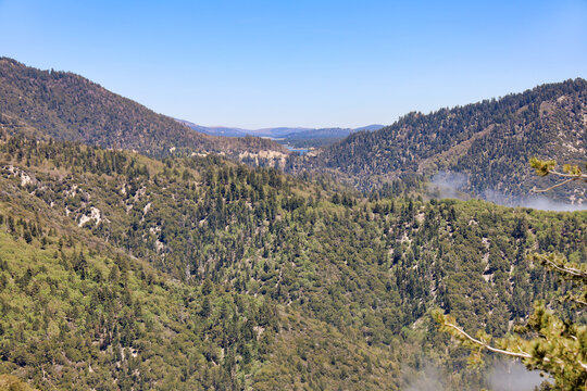 View of San Bernardino Mountains and Big Bear Lake on the horizon from the side of highway 18. Southern California, USA.