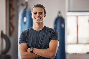 Gym, fitness and portrait of proud man standing with smile, motivation, health and energy for training. Coach, personal trainer or happy boxing club owner in studio for workout, coaching and wellness