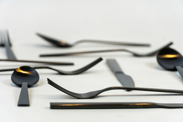black metal forks and spoons on a white background, mexico
