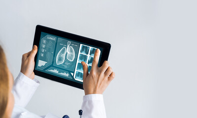 Close of female doctor hands working with tablet pc computer
