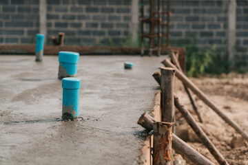 Selective focus, Sewage pipe installation in construction site.Construction pouring concrete floor....