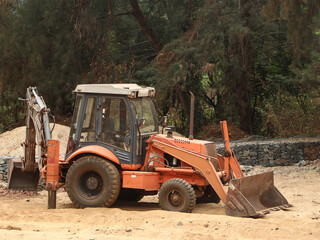 bulldozer excavator parked after work on a construction site 