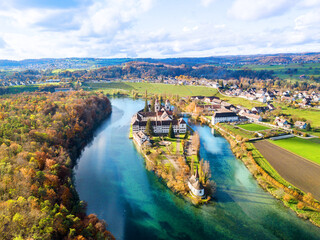 Aerial view of the Rheinau Abbey Islet on Rhine river in autumnal splendid colors, Switzerland