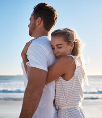 Hug, love and beach with a young couple enjoying a date in nature together for romance or vacation. Summer, travel and hugging with a man and woman dating on a coast holiday by the sea or ocean