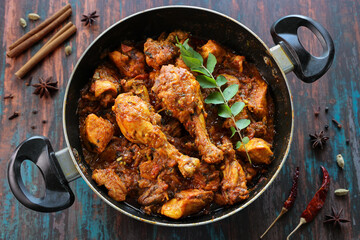 Masala Chicken curry with Appam Kerala breakfast , Hoppers pan cake , homemade chicken roast Indian spices , Asian cuisine spicy meat curry cooked in coconut milk . side dish Christian food Christmas