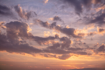 Colorful clouds at sunset as background.