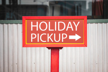 Holiday shopping pickup sign at store