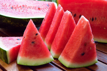 juicy watermelon cut into triangles and slices