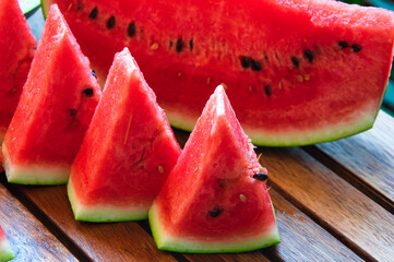 juicy watermelon cut into triangles and slices