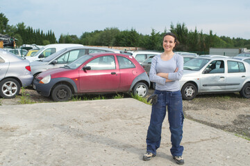 female mechanic in scrap yard