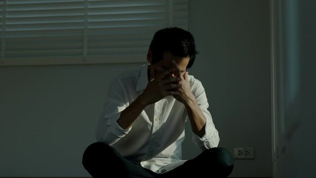 Depression and mental illness. Asian man disappoint, sad after receive bad news. Stressed boy confused with unhappy problem, arguing with girlfriend, cry and worry about unexpected work, down economy.