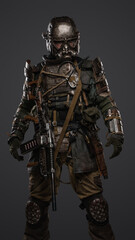 Portrait of military survivor in post apocalypse dressed in armored costume.