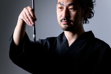 Image like a Japanese calligrapher 「shodo」holding a brush. closeup