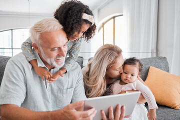 Tablet, family diversity and happy grandparents, children and baby enjoy quality time together,...