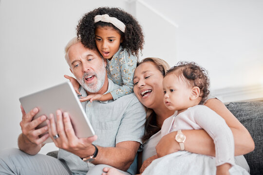 Family selfie, tablet and social media, picture and happy smile with grandparents and girl children on sofa in home. Senior man, woman and kids funny face, fun and enjoying bonding in family home