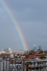 Rainbow over the city of Barcelona (Spain) on a stormy day.