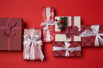Group of gift boxes on red background.
