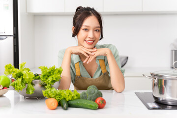 Portrait of a housewife in the kitchen at home