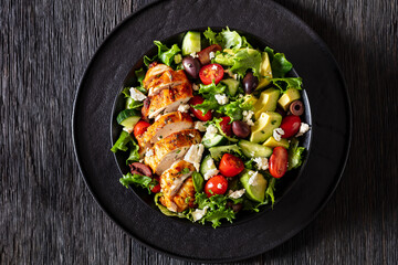 Mediterranean grilled Chicken Salad in black bowl