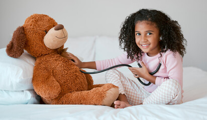 Learning, teddy bear and girl playing with stethoscope, having fun or acting like doctor in...