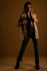 Posing cool alone in studio on yellow background while having fun